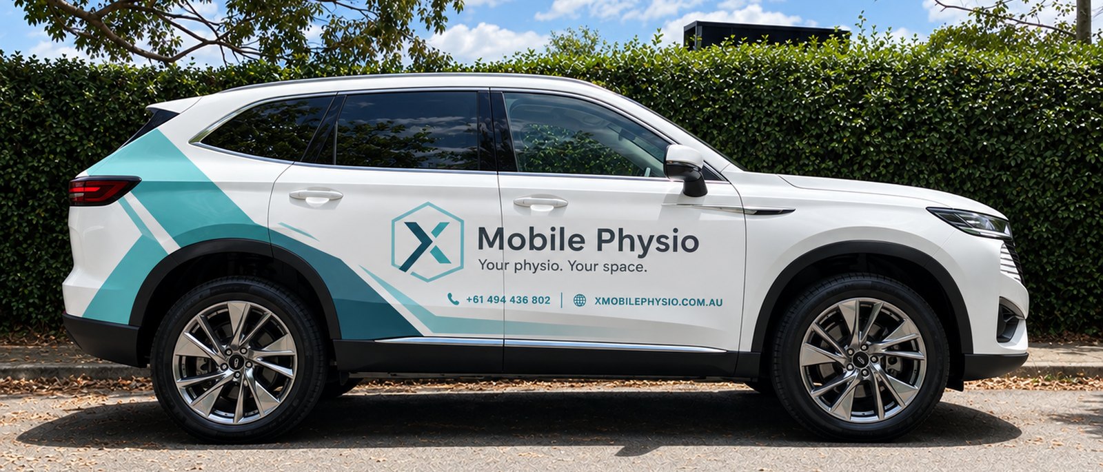 The X Mobile Physio vehicle, marked with the logo, phone number and website address